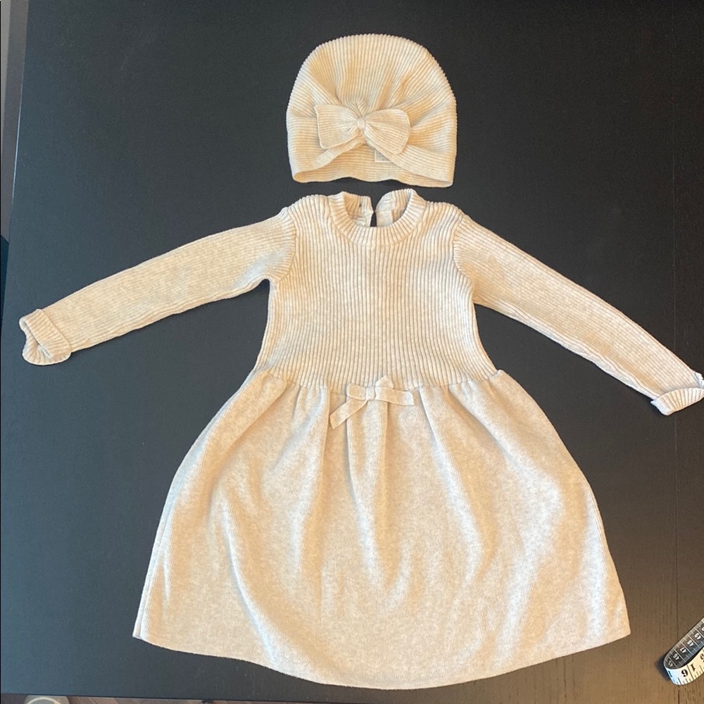 Knitted baby dress with matching hat  in cream
